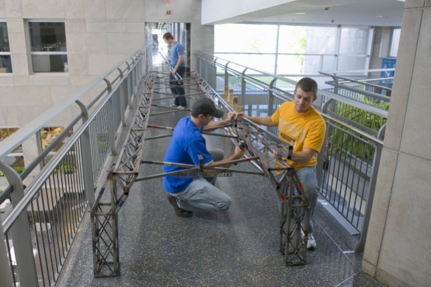 students building bridge model