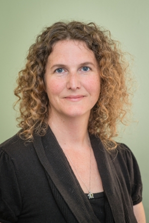Barb Adams in a dark shirt smiling at the camera