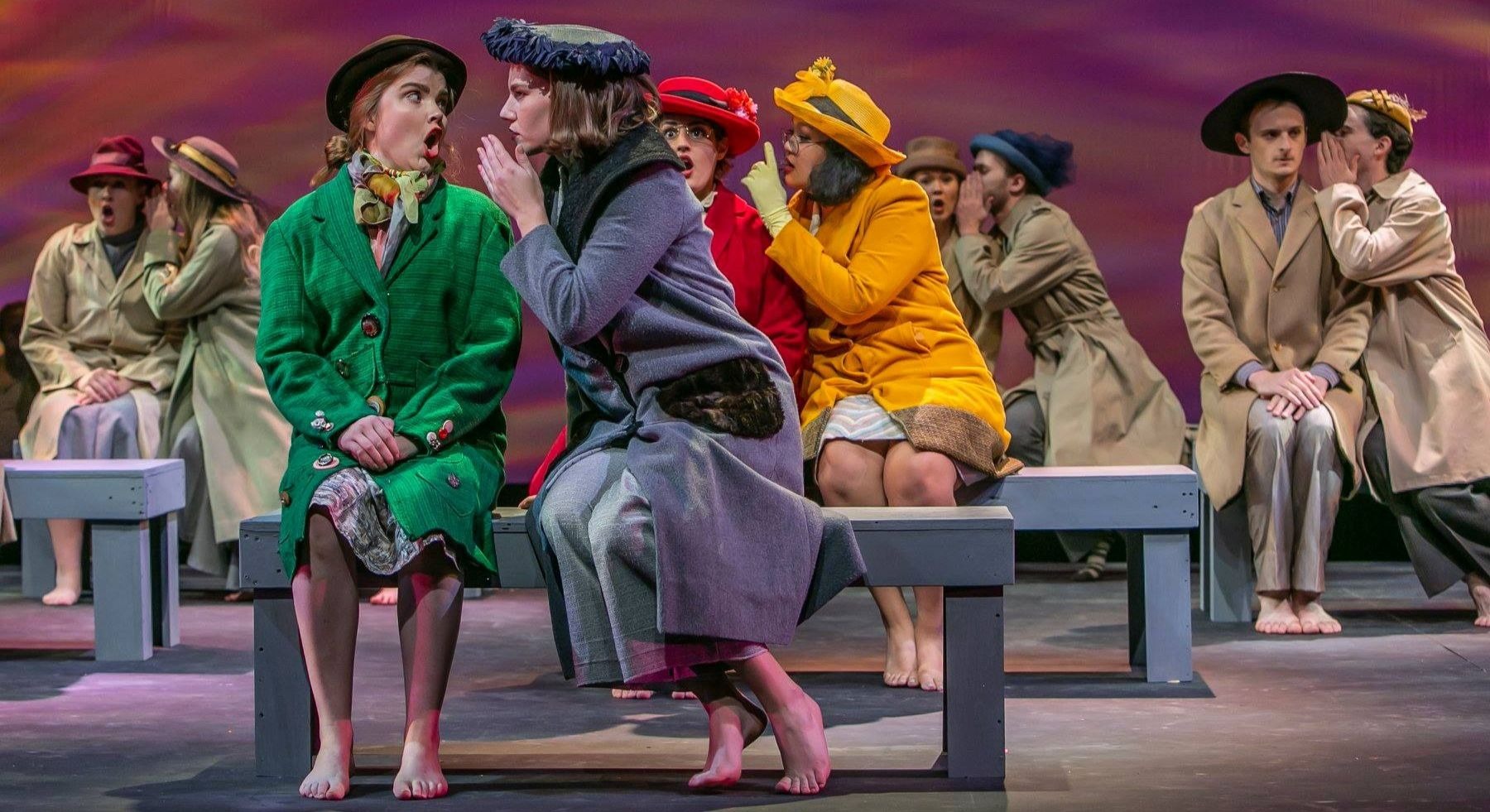 Photo from “Breath: A Samuel Beckett Festival” of actors in pairs seated on benches wearing coats and hats.