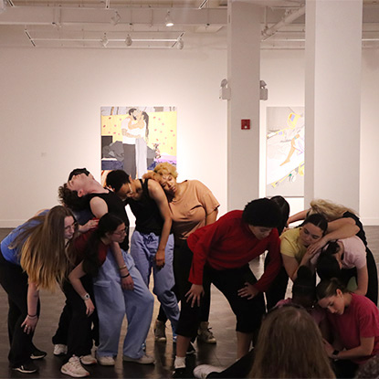 Dance Improvisation II students dancing in art museum gallery.