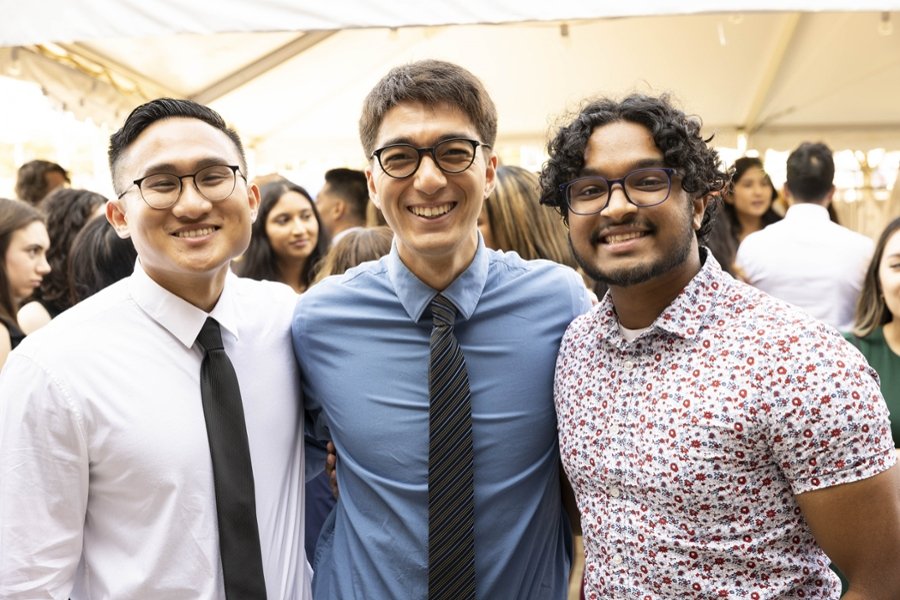 A group of three CMSRU students pose for a photo together at their White Coat Ceremony.