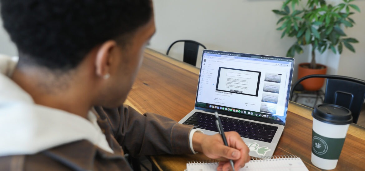 A student looks at their computer.