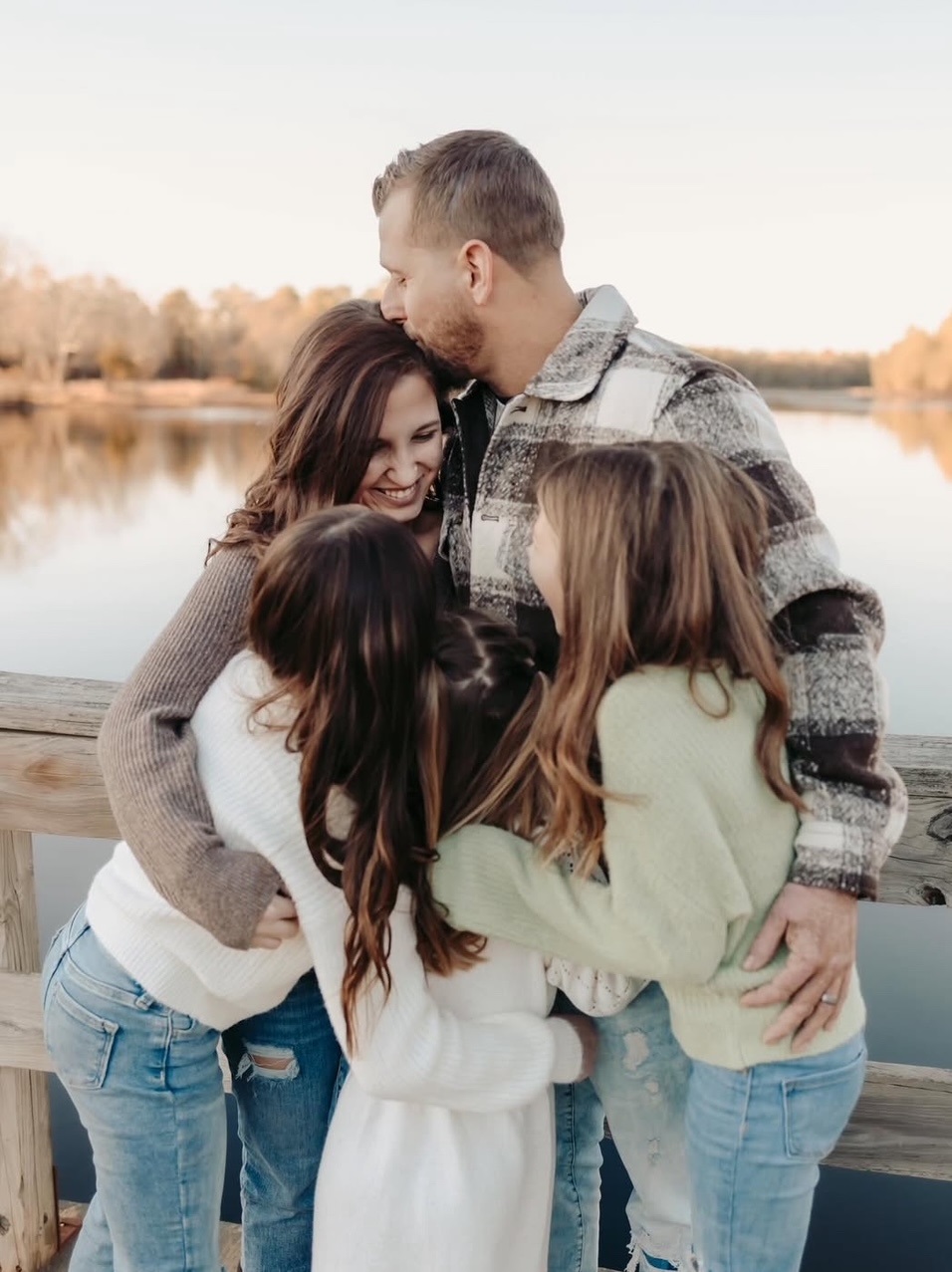 Gabrielle F. hugs her family.
