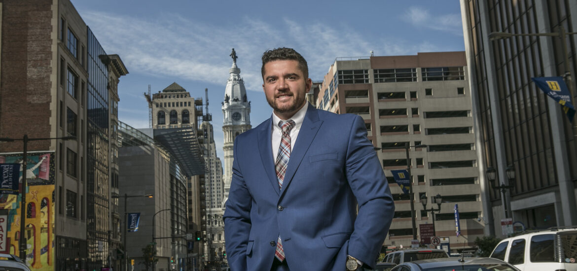 A Rowan graduate poses for a photo in Philadelphia, PA.
