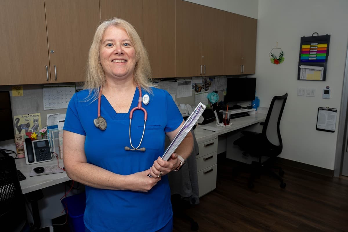 Student Kim Ramsey posing in a medical examination room.