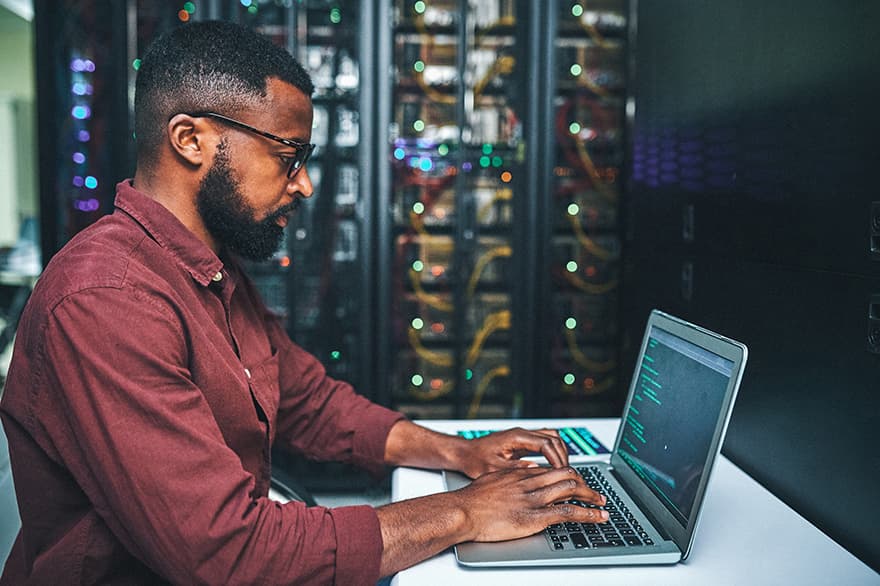 A student works on their laptop.