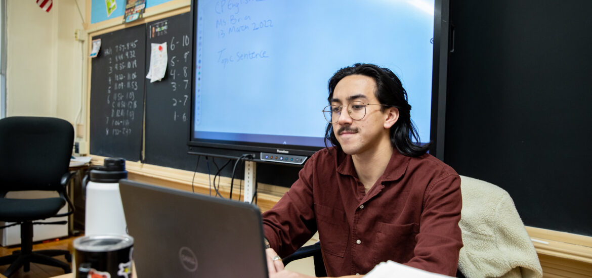 A student works on their computer.
