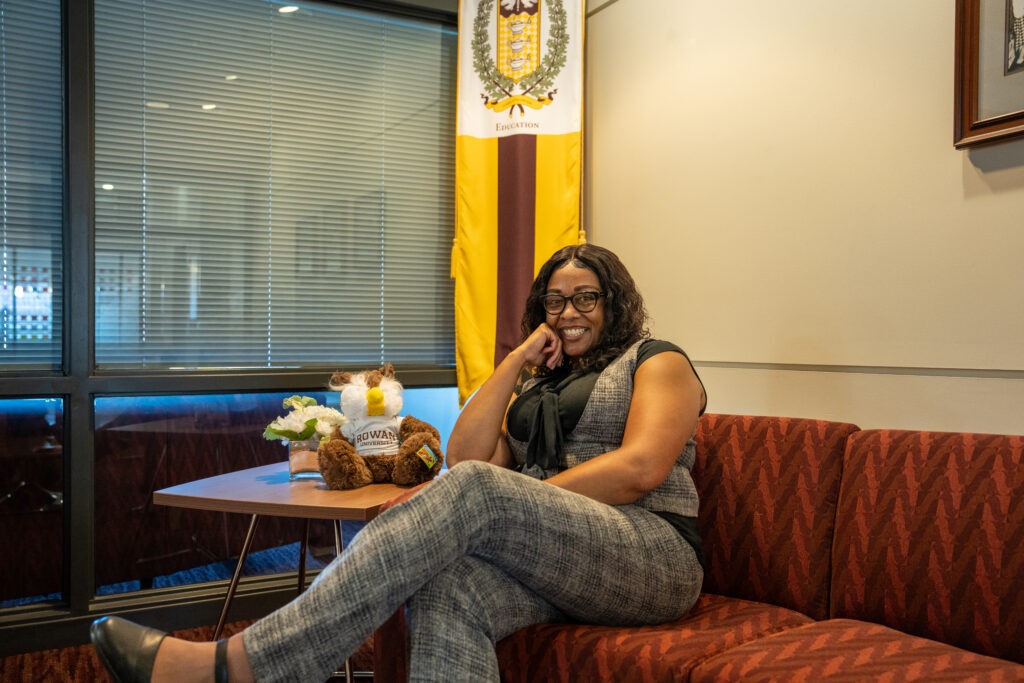 Tajauna sits on a couch in James Hall, the main building for College of Education students at Rowan.