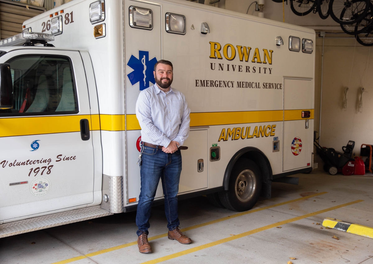 A student works outside on their laptop.
