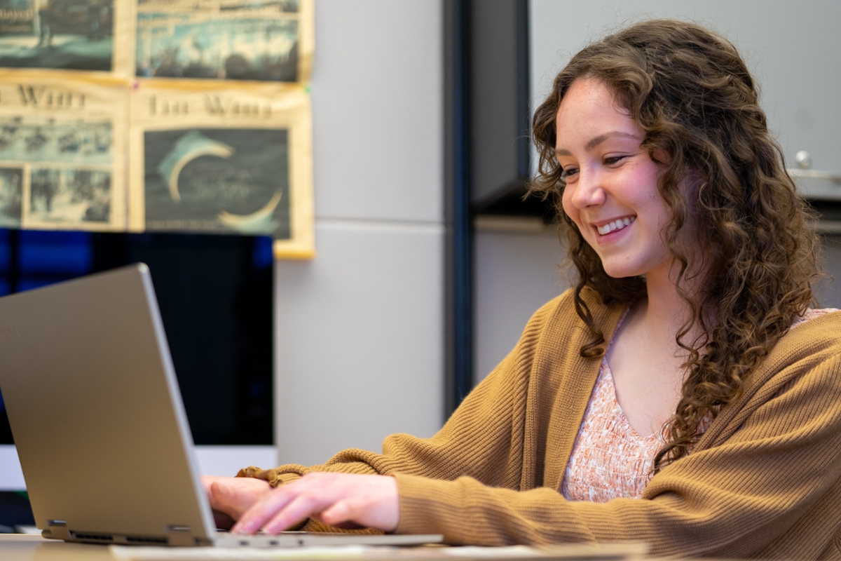 A student working on their laptop.