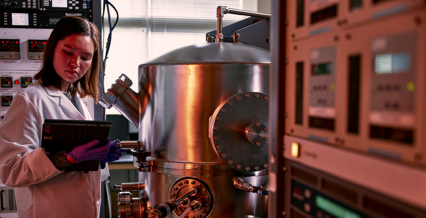 Rowan University student conducts research in a lab.