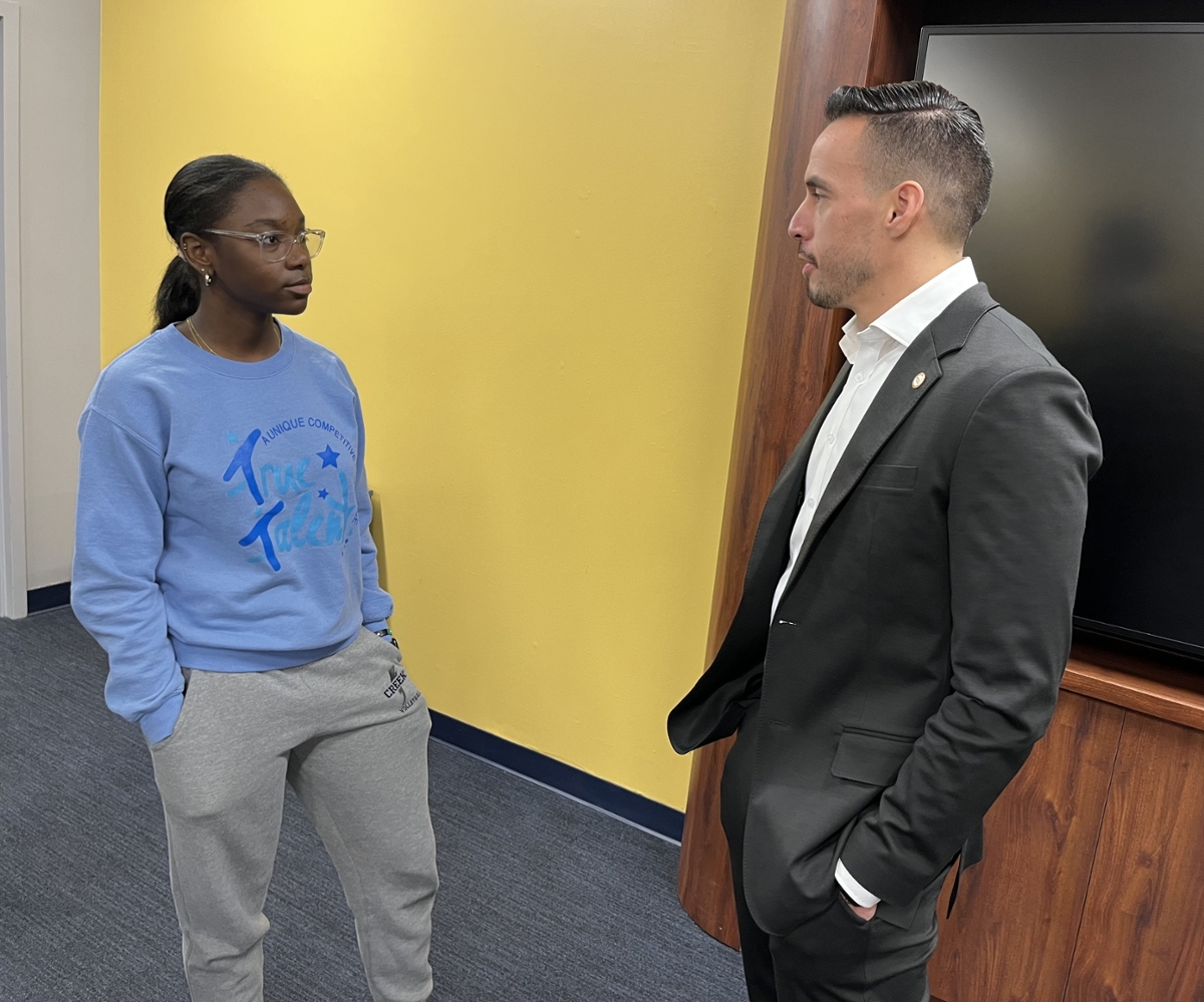 A RIPPAC student talks to Spring 2025 Open House guest speaker Kyle Melander