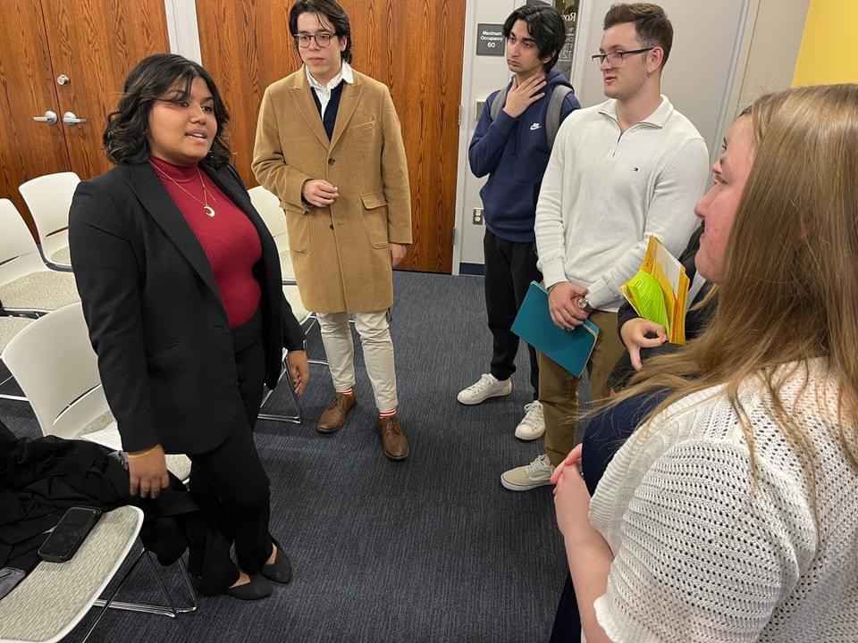 Hafiza Kazi speaks with students at the Spring 2024 RIPPAC Open House