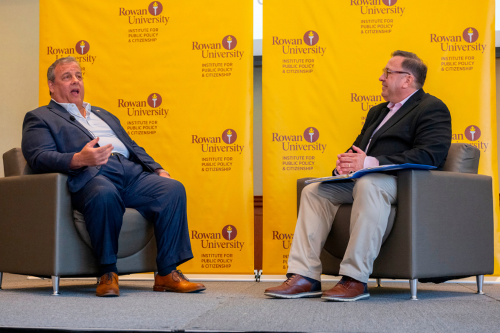 Former NJ Governor Chris Chris sitting across from RIPPAC Director Benjamin Dworkin in conversation at MAPIS2025