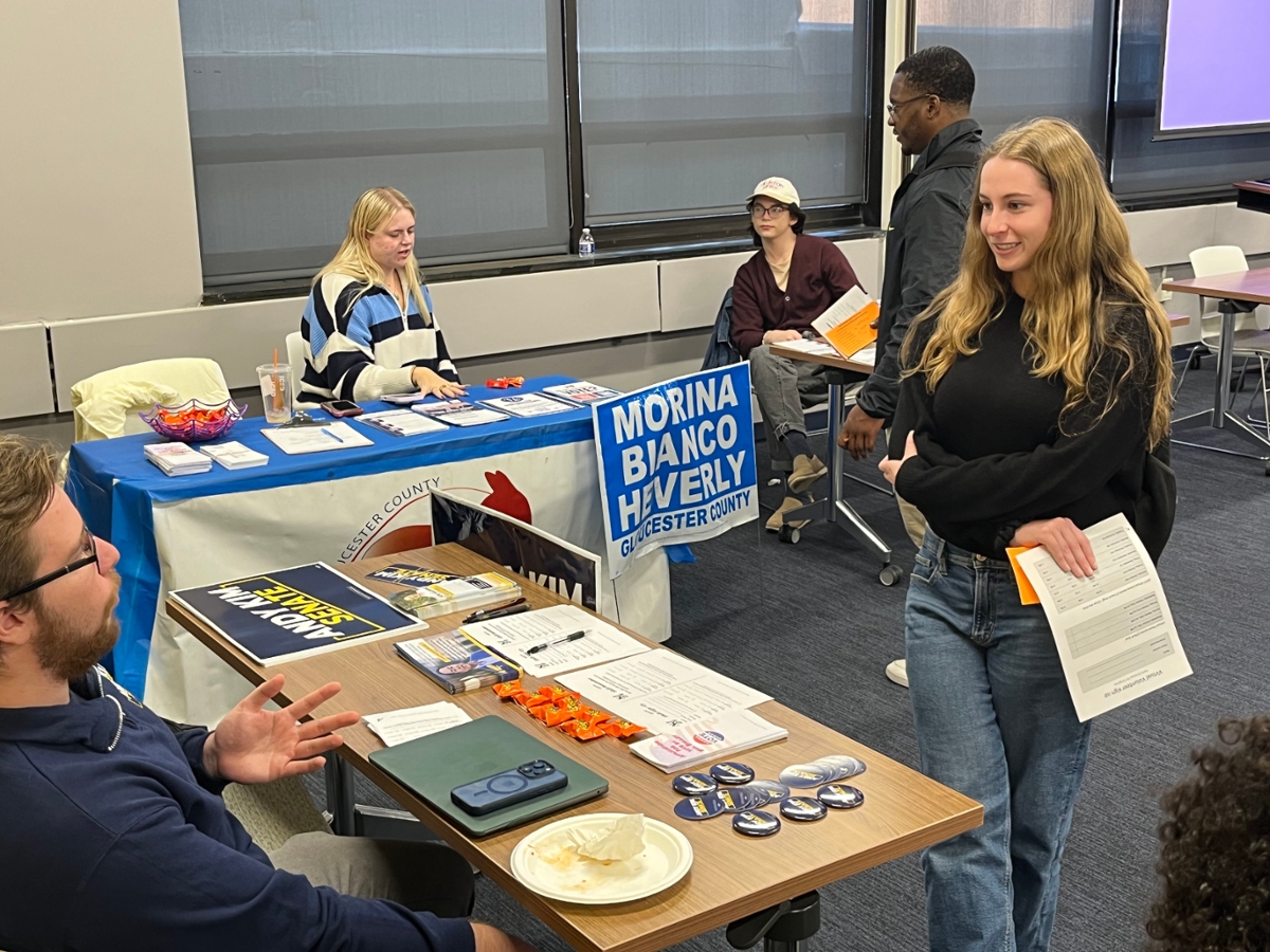 Student talks to a representative from the Andy Kim campaign at the 2024 RIPPAC Political Campaign Volunteer Fair