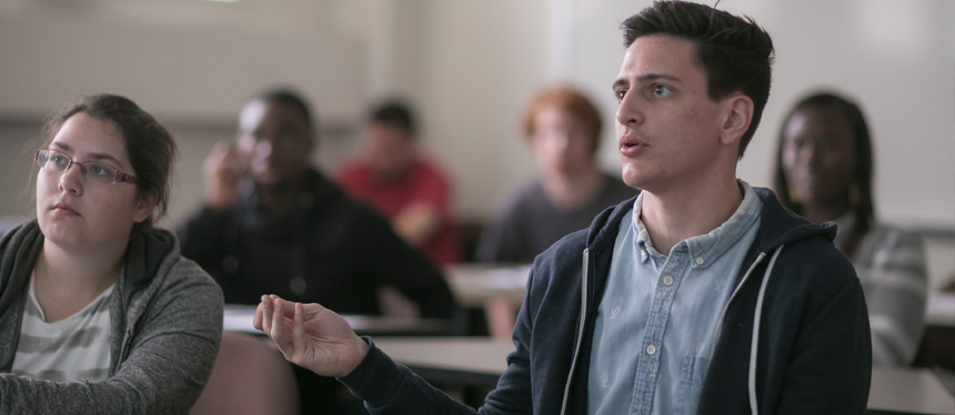student speaking in a class lecture