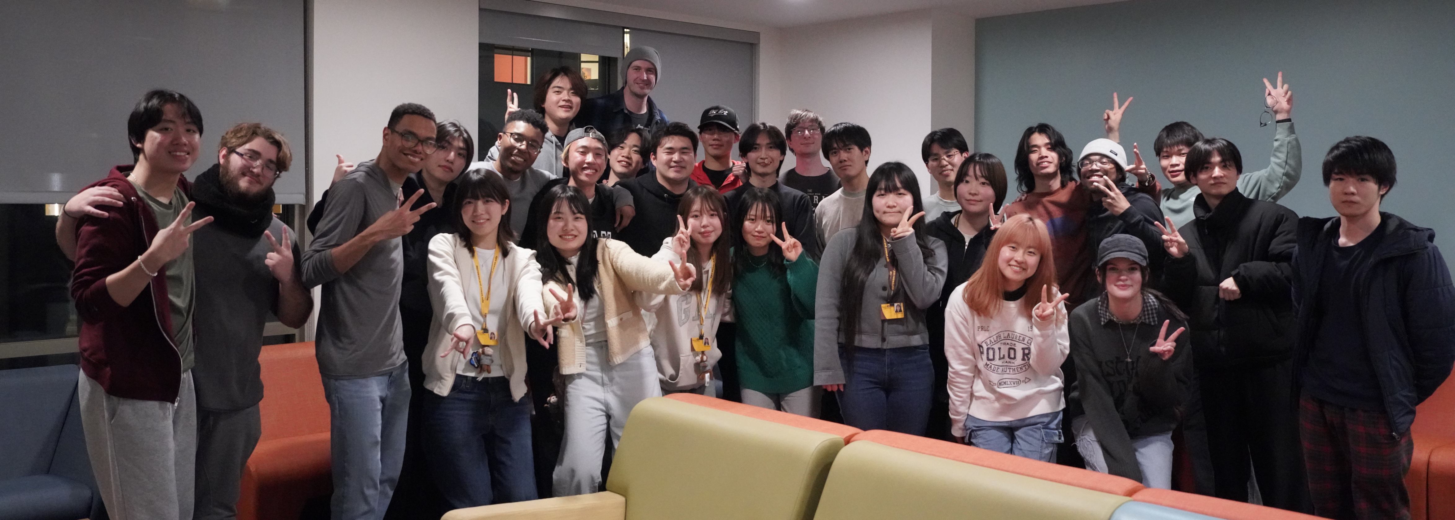 JCC members and exchange students smiling as a group.