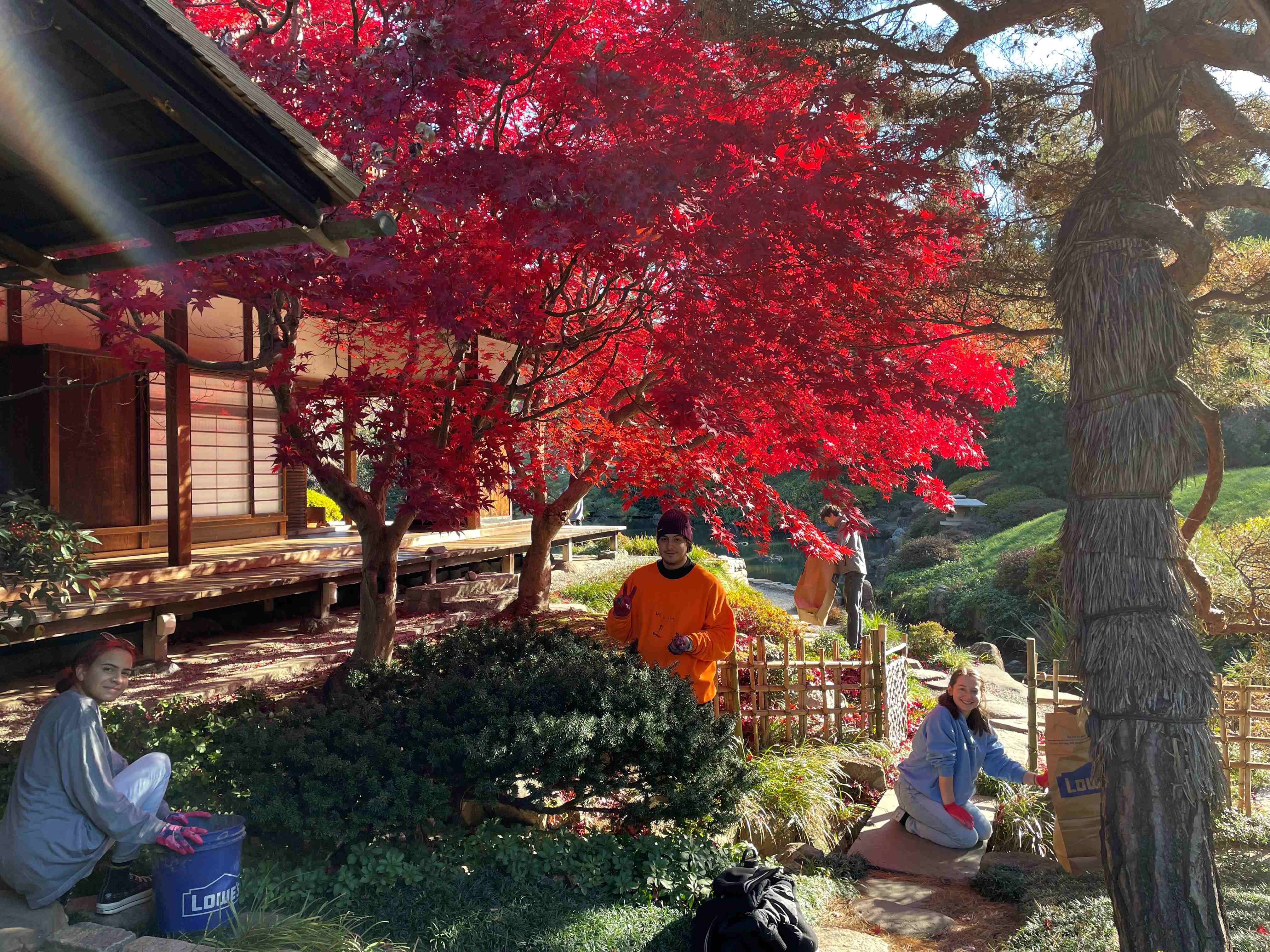 Students cleaning the garden.