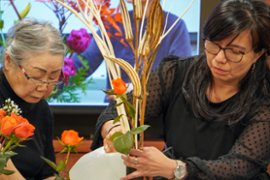 Mrs. Mariko Ono demonstrating her Ikebana creations with Professor Matsumura Dusk.