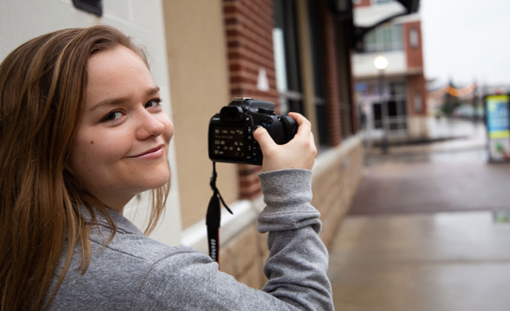 Rowan Productions student with a camera