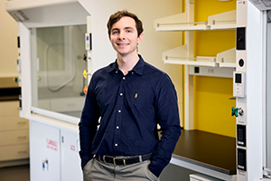 Morgan Antisell stands in a lab