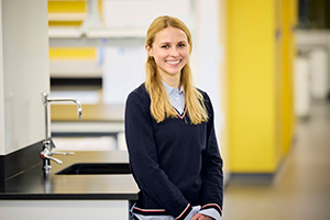 Emily Kopchick stands in a lab