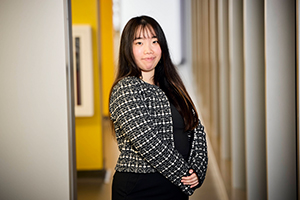 Hoi Yan Yu stands in a lab