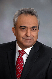 Hamid Seyyedhosseinzadeh smiles at the camera for a headshot